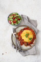Corn porridge with meat sauce and salad. Dish of Spanish, Italian, Indian, American cuisine,Romanian cuisine