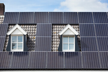 Alternative energy from solar panels on a roof with two dormers