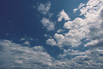 cumulus clouds set against a blue sky.
