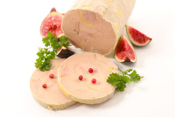foie gras slices with red pepper and fresh fig on white background