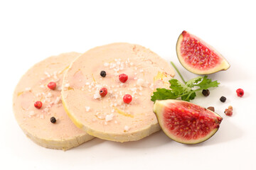 foie gras slices with red pepper and fresh fig on white background