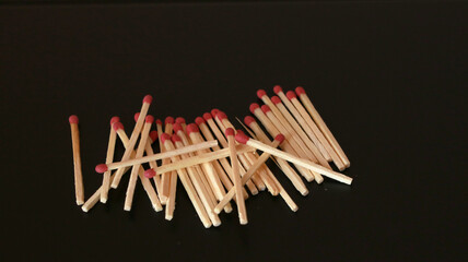 Matches close up on black background