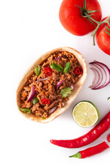Mexican barquita taco with beef, chilli, tomato, onion and spices isolated on white background	