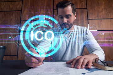 Good looking man working on ICO project. Multiexposure. Crypto currency concept.