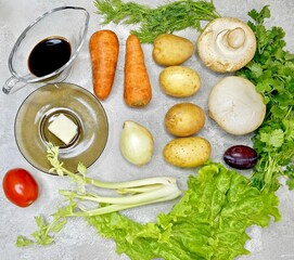 Fresh vegetables in the skin, mushrooms and other ingredients for preparing a hot dish