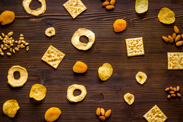 Pattern of snacks mix top view - nuts and dried fruits