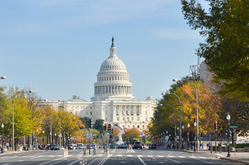 Capitol Building in autumn colors as seen from Constitution street - Washington D.C. United States...