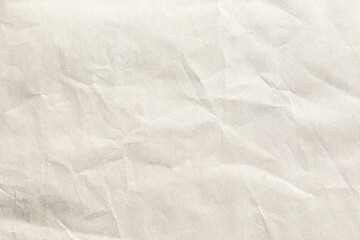 Crumpled pale brown background paper texture