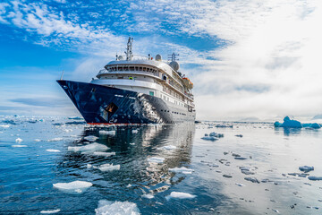 Antarctica, Antarctic Peninsula, near Yalour Island.  A expedition ship is anchoring in the calm...