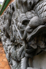 Fototapeta na wymiar Chinese dragon on stone wall