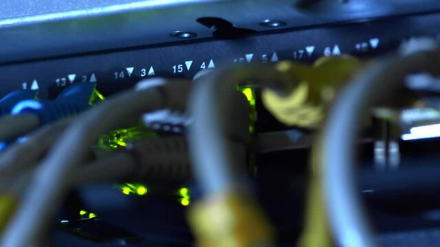 Status indicator light of network equipment connected to the server system with LAN cable on the development of computer network technology.