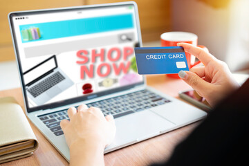 Online Shopping Website on Laptop. Easy E-commerce Website Shop by Smartphone, iPhone, iPad and Laptop. Close up Hands Using Smartphone Shopping Cart read Online Article, Blog. Digital Payment gateway