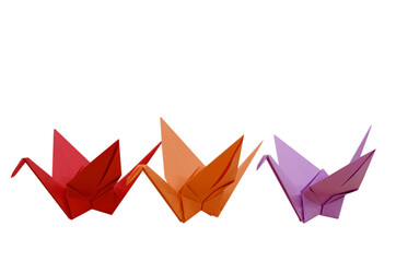 three colorf origami cranes isolated white