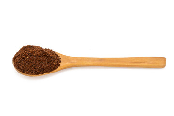 Wooden spoon with ground coffee.