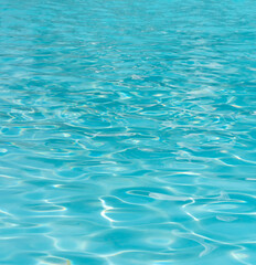 Reflections on a surface of a water in a pool closeup view.