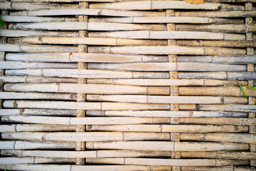 Bamboo sticks wooden background with thread uniting