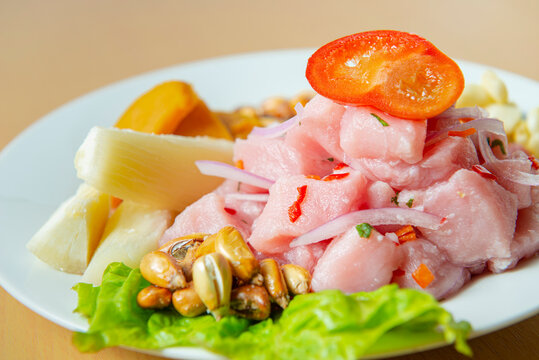 Traditional seafood ceviche from Peru with chili peppers, chickpeas. Close up.