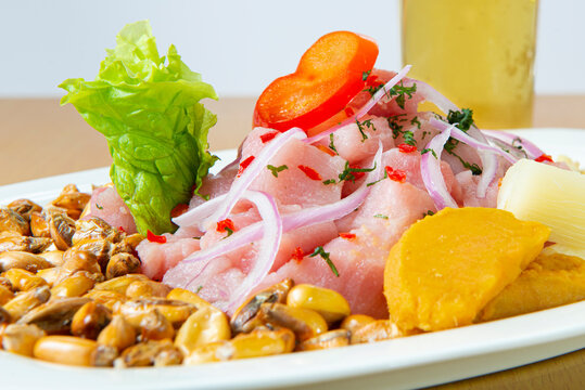 Delicious seafood ceviche from Peru with chili peppers, chickpeas. Close up.