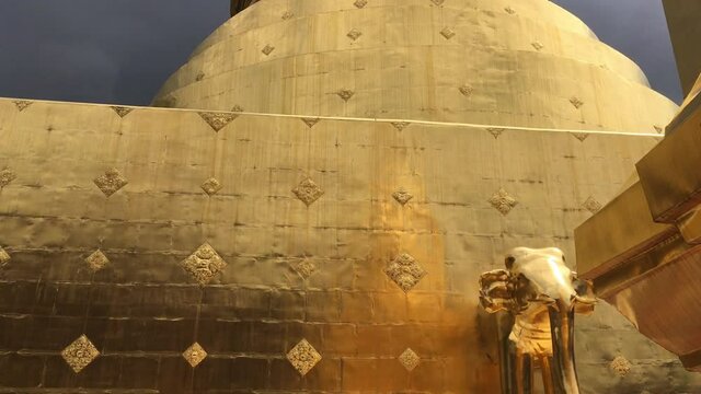 Close up golden pagoda of Phra Singha public Thai temple