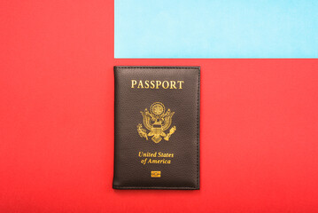 Simple image of an American passport with red and blue background.
