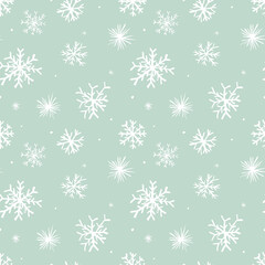 Hand-drawn snowflakes on blue background; xmas seamless pattern; pastel winter wallpaper; vector backdrop