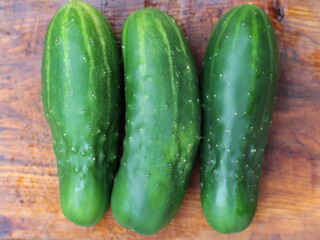 fresh cucumbers on a wooden table