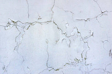 Сracks in the white wall.