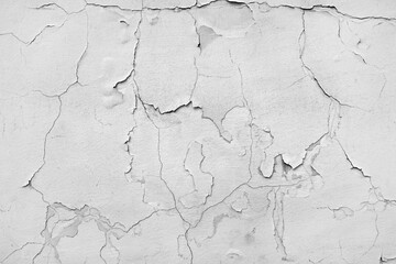Сracks in the white wall.