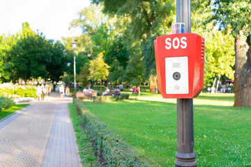 Fototapeta na wymiar SOS, police, emergency button in the public park.