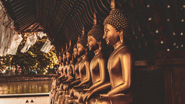 Golden Buddha statues in a Buddhist temple.