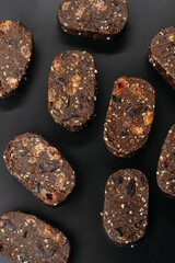 Handmade chocolates on dark background.