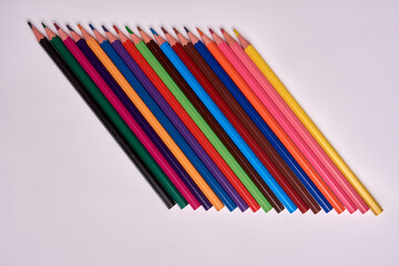 colored pencils on a white background