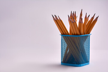 pencils in a office glass on a white background