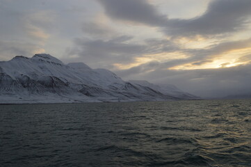 Winter sunset over the ice fjords of the Archipelago of Svalbard (Spitsbergen) in Norway