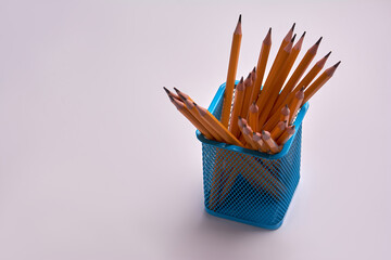 pencils in a office glass on a white background