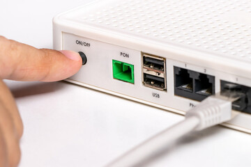Man turns or turns off on internet router. Using network