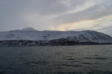 Winter sunset over the ice fjords of the Archipelago of Svalbard (Spitsbergen) in Norway
