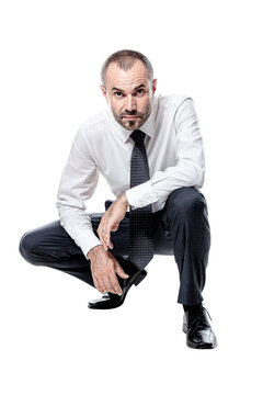 Businessman Crouching Isolated On White.