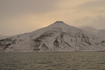 Winter sunset over the ice fjords of the Archipelago of Svalbard (Spitsbergen) in Norway