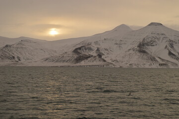 Winter sunset over the ice fjords of the Archipelago of Svalbard (Spitsbergen) in Norway