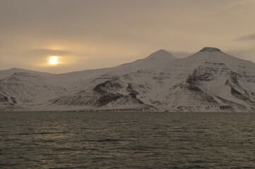 Winter sunset over the ice fjords of the Archipelago of Svalbard (Spitsbergen) in Norway