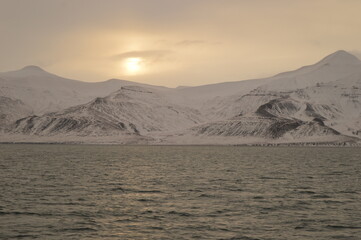 Winter sunset over the ice fjords of the Archipelago of Svalbard (Spitsbergen) in Norway