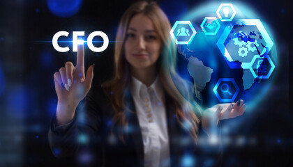 Business, Technology, Internet and network concept. Young businessman working on a virtual screen of the future and sees the inscription: CFO