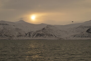 Winter sunset over the ice fjords of the Archipelago of Svalbard (Spitsbergen) in Norway