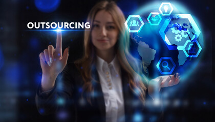 Business, Technology, Internet and network concept. Young businessman working on a virtual screen of the future and sees the inscription: Outsourcing