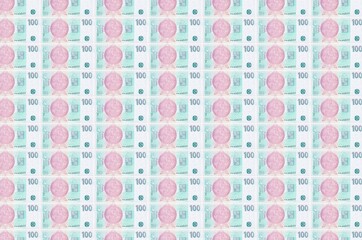 100 Czech korun bills printed in money production conveyor. Collage of many bills. Concept of...