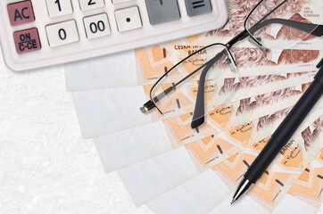 200 Czech korun bills fan and calculator with glasses and pen. Business loan or tax payment season...