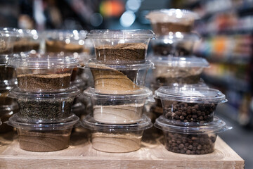 various spices and herbs packed in small transparent plastic boxes