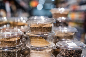 various spices and herbs packed in small transparent plastic boxes