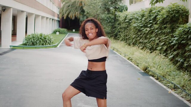 Black woman dancer on street, african american woman dancing hip-hop, outdoor training dance, happy student girl, palms alley, latin contemporary moves, social media blogger